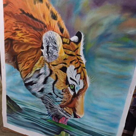 Tiger drinking water on artwork